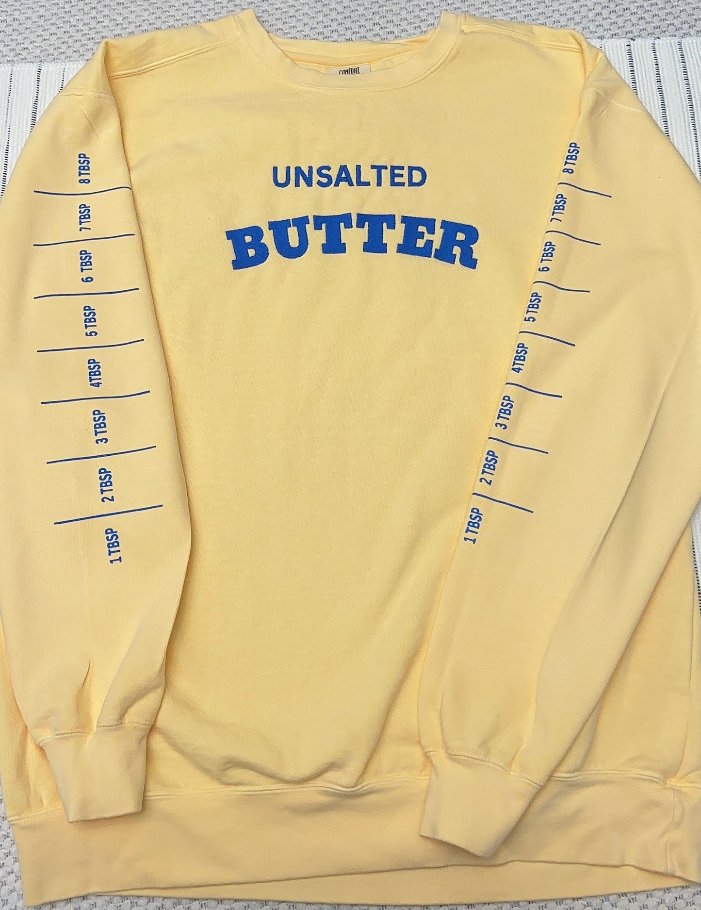 Embroidered Salted Butter with ONE sleeve printed and embroidered butter stick on the right sleeve Comfort Colors sweatshirt